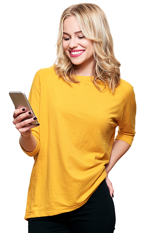 Woman in a yellow shirt smiling while on her phone